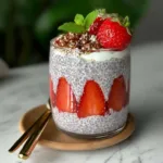 Delicious strawberry crumble chia pudding topped with fresh strawberries