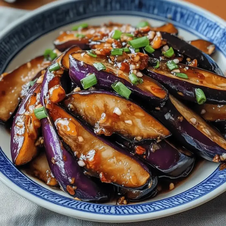 Stir-fried eggplant in garlic sauce with scallions.