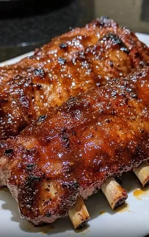 Delicious oven baked ribs served with a flavorful glaze