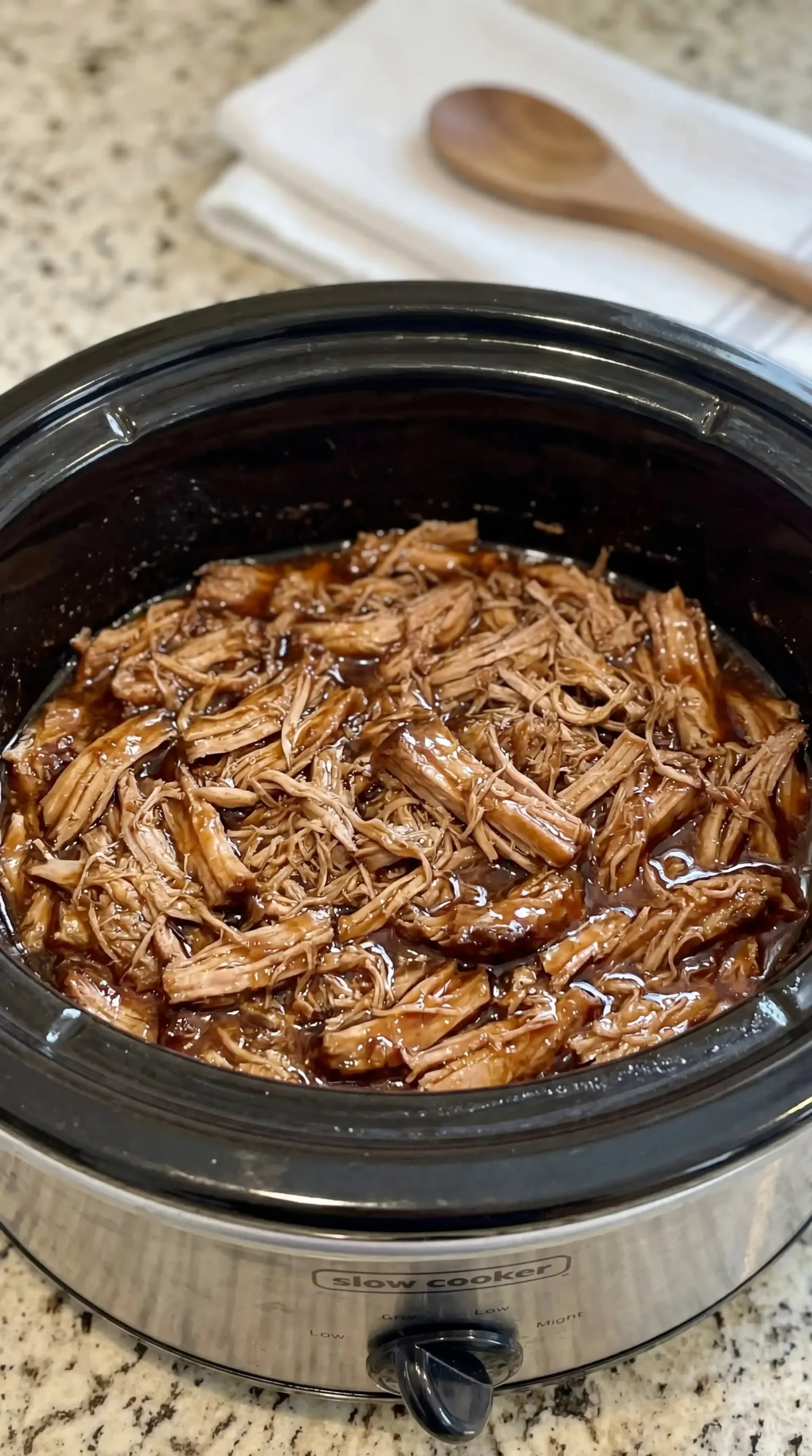 Slow Cooker Kalua Pig 6 Slow Cooker Kalua Pig dish with seasonings and pork served in a bowl
